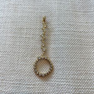 Gold plated with clear stones cigarette holder/joint holder ring.